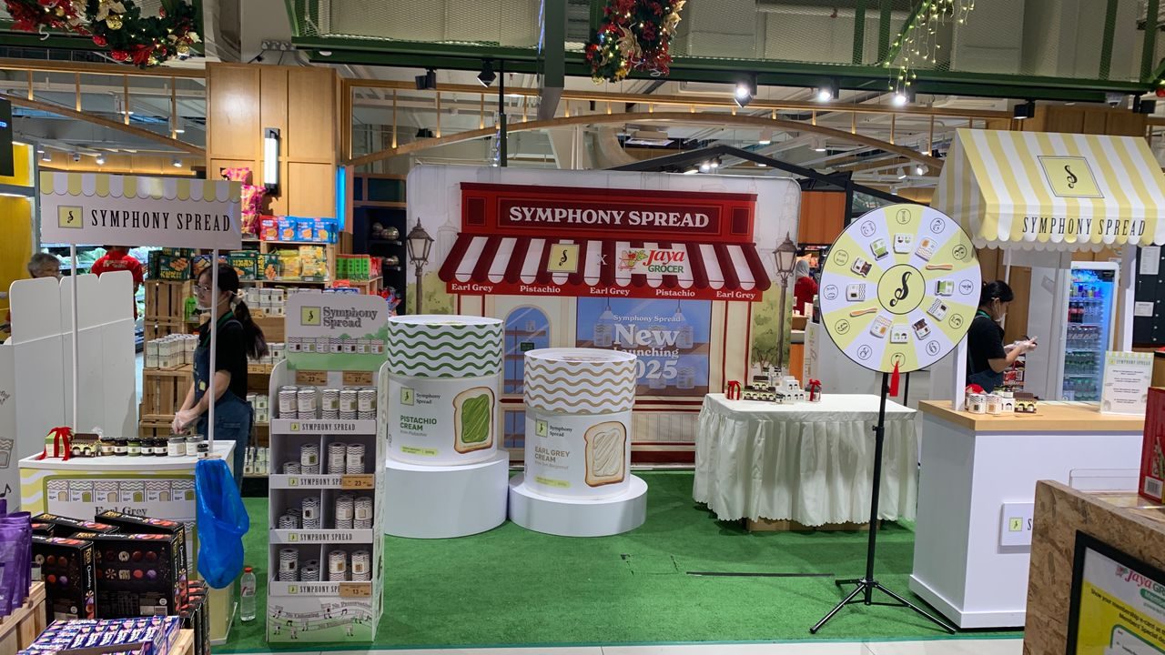 Symphony Spread activation booth with prize wheel and branded canopy